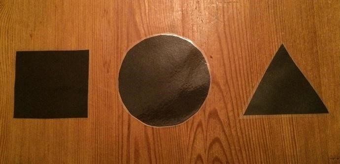 a black square, circle, and triangle