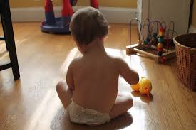 A baby playing with toys.