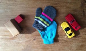 blocks, mittens, and toy cars