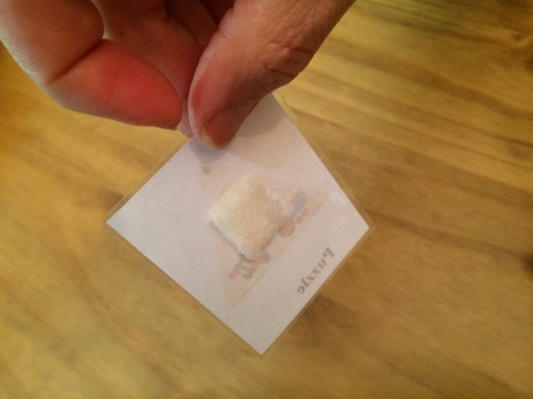 Velcro stuck to the back of a picture.