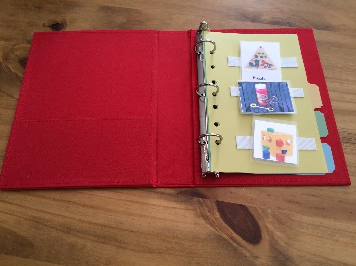 A PECS binder with pictures